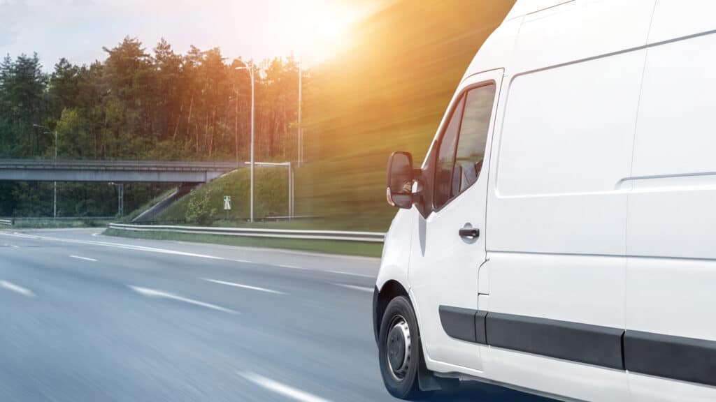 Service van driving down highway